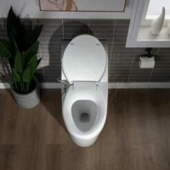WOODBRIDGE T-0042 One Piece 1.1GPF/1.6 GPF Dual Flush Elongated Toilet With Non-Electric Toilet Seat In White -Woodbridgebath Shop 5f6d4d4008937 thumb 600x600