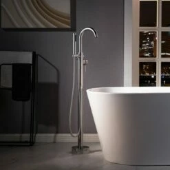 WOODBRIDGE F0024CHRD Contemporary Single Handle Floor Mount Freestanding Tub Filler Faucet With Cylinder Shape Hand Shower In Polished Chrome Finish.