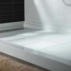 WOODBRIDGE SBR6030-1000L Solid Surface Shower Base With Recessed Trench Side Including Stainless Steel Linear Cover, 60" L X 30" W X 4" H,Left Drain White Color -Woodbridgebath Shop 61dd4d9179108 thumb 600x600