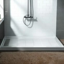 WOODBRIDGE SBR6032-1000L Solid Surface Shower Base With Recessed Trench Side Including Stainless Steel Linear Cover, 60" L X 32" W X 4" H, Left Drain White Color -Woodbridgebath Shop 61de9f7b2df10 thumb 600x600