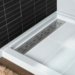 WOODBRIDGE SBR6036-1000L Solid Surface Shower Base With Recessed Trench Side Including Stainless Steel Linear Cover, 60" L X 36" W X 4" H,Left Drain White Color -Woodbridgebath Shop 61dfcb3aeaf40 thumb 600x600